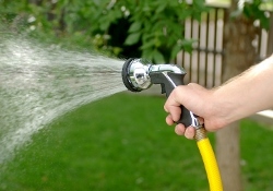 watering your lawn in hot weather